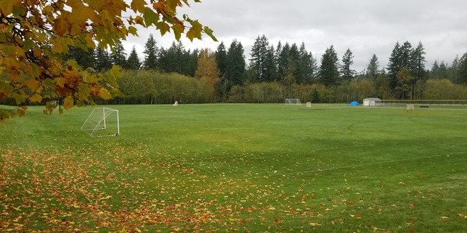 empty football field at Klahanie Park with soccer goal at end