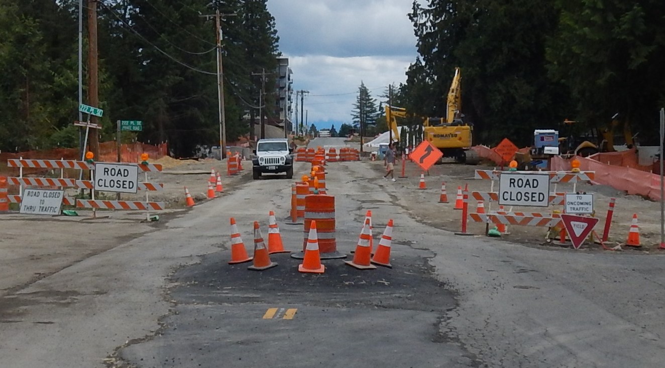 cones and road barriers mark passage for through traffic during construction