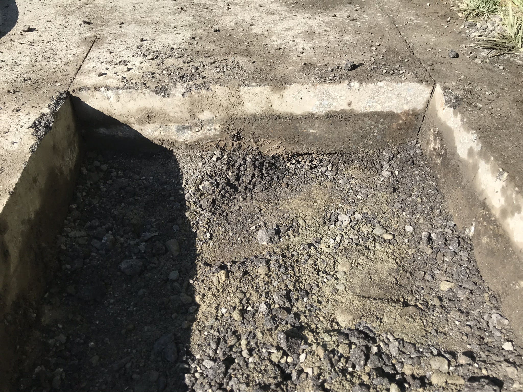 Close-up of the pavement after potholing on the Ebright Creek Fish Passage Project.