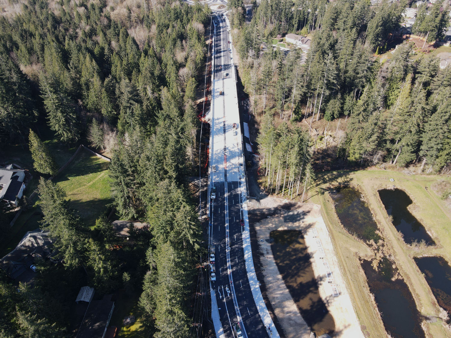 aerial of Issaquah Fall City Road bridge with roundabout in the distance