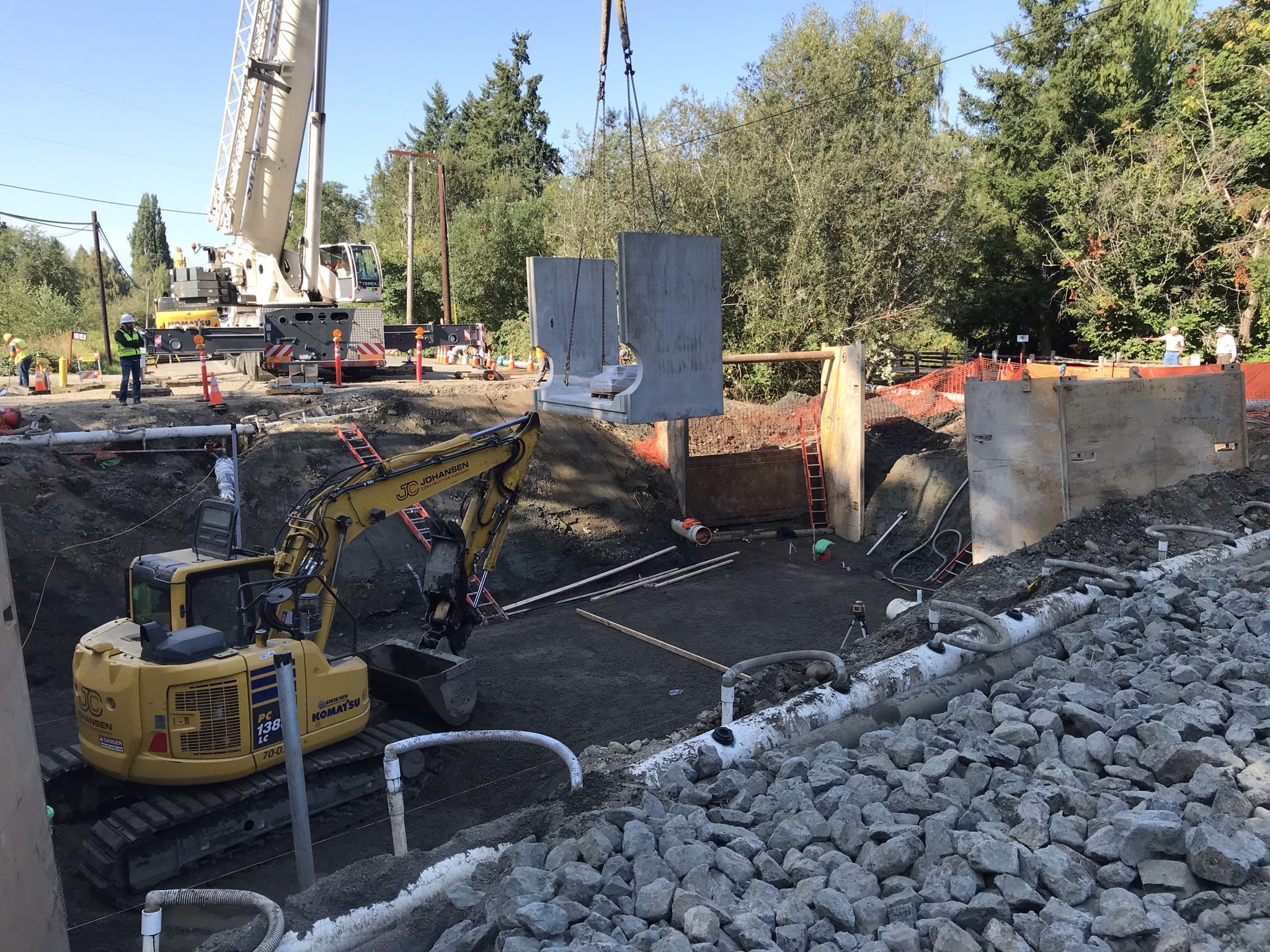 The first culvert base section being lowered into place for the Ebright Creek Fish Passage project.