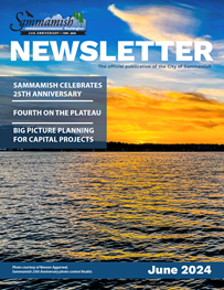 A magazine cover featuring a sunset over a lake
