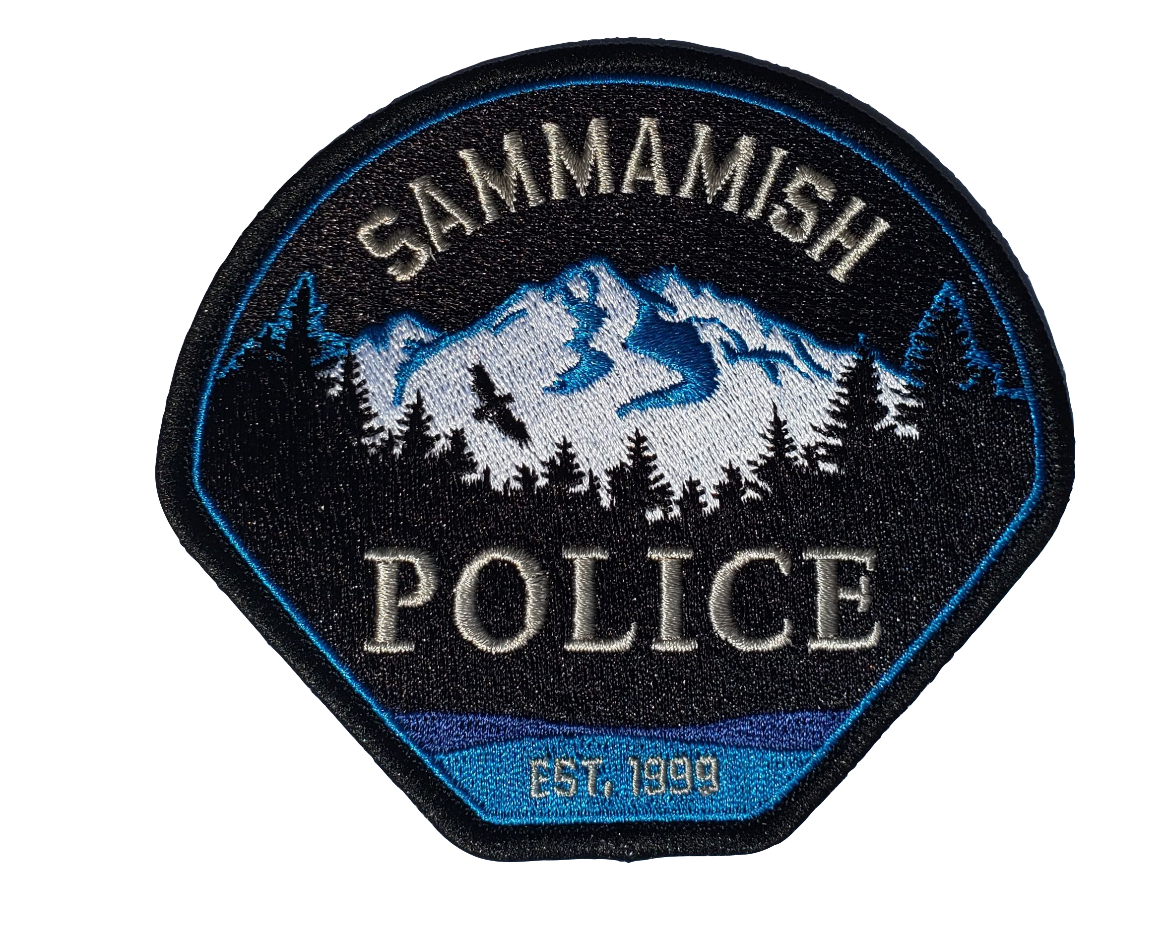 Sammamish Police patch in blue, black, white and tan, showing a forest before a snowy mountain