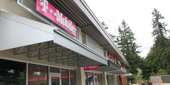 awnings of commercial area at The Village at Sammamish Town Center including a T Mobile store and two other retailers