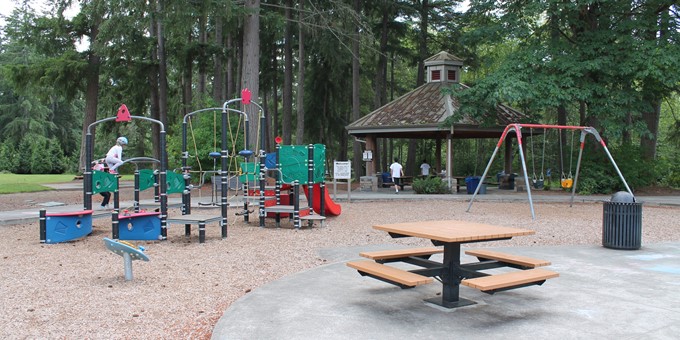 Playground area, picnic table, and picnic shelter at Ebright Creek Park in Sammamish.
