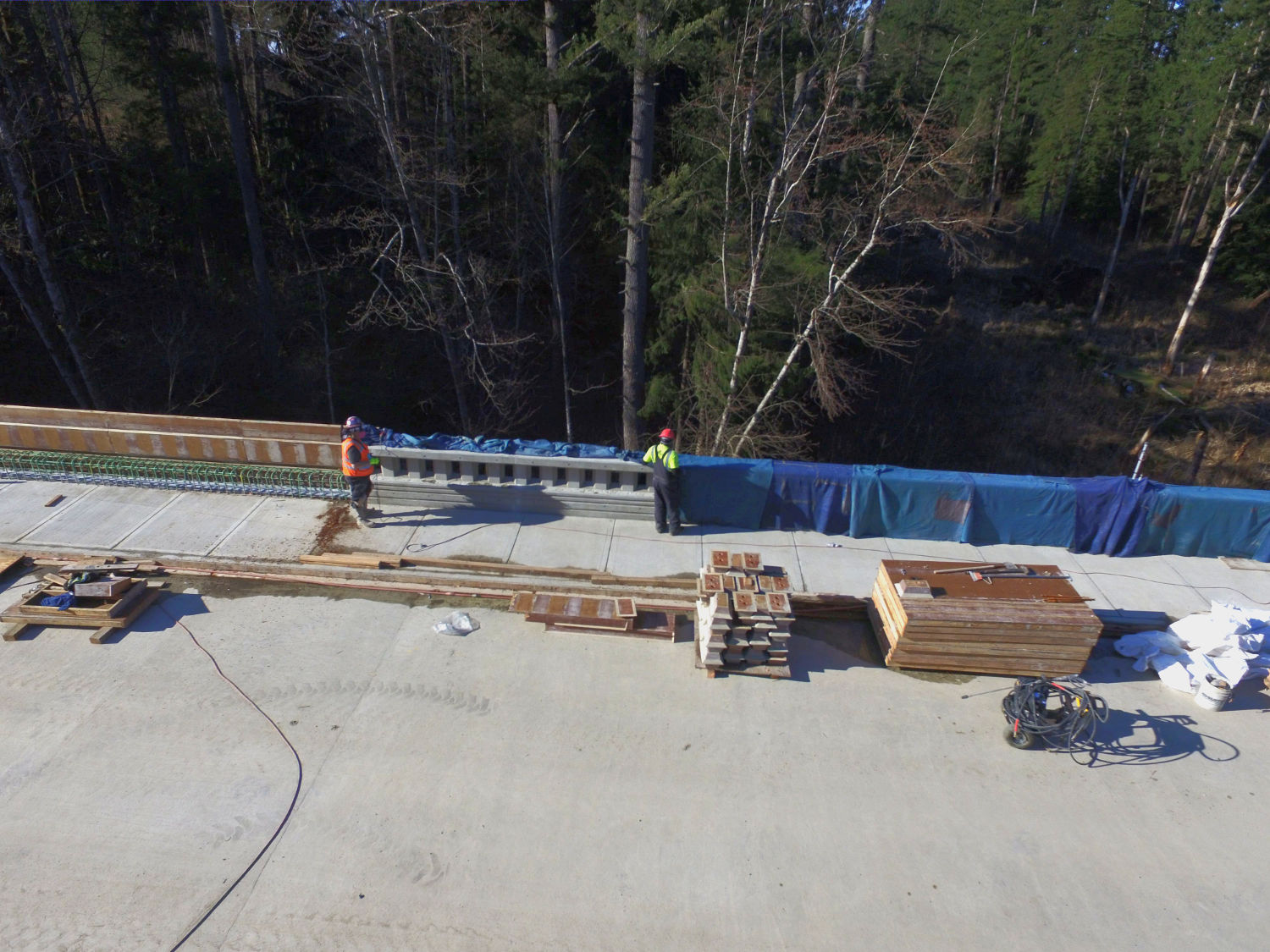 construction of bridge on Issaquah Fall City Road with railings being built beside sidewalk