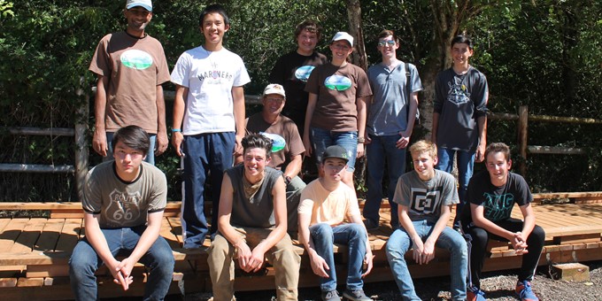 Eleven Sammamish stewards taking a break from their hard work on the boardwalk trail.